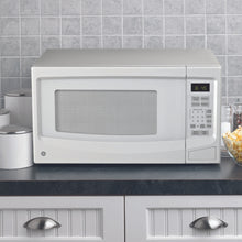 Four à micro-ondes de comptoir 1,1′ GE blanc