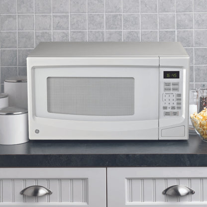Four à micro-ondes de comptoir 1,1′ GE blanc